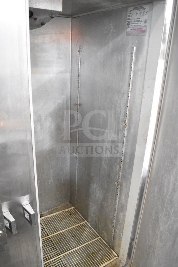 Continental 2RE Commercial 2 Door Reach In Cooler, stainless steel interior, commercial casters, 115 volts, 1 phase.
