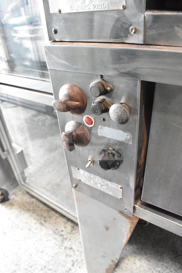 Bakers Pride E541 electric pizza oven, 2 deck, on metal legs, 208V, 3 phase, visible control knobs, used condition.