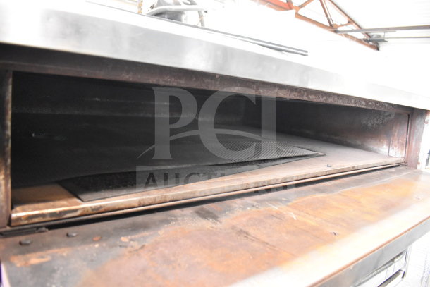 Bakers Pride E541 commercial electric pizza oven, 2 deck, metal legs, 208 volts, 3 phase, interior view, used condition.