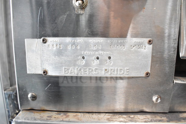 Bakers Pride E541 commercial pizza oven, metal legs, 2 decks, 208V, 3 Phase, tag shows model, serial, voltage, and brand.