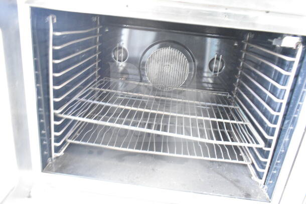 Blodgett commercial full-size gas convection oven with view-through doors and thermostatic controls, interior racks visible.