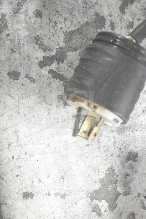 Close-up of power plug for Bunn H5E-40 Commercial Countertop Hot Water Heater, 208 Volts, displaying metal prongs and black casing.