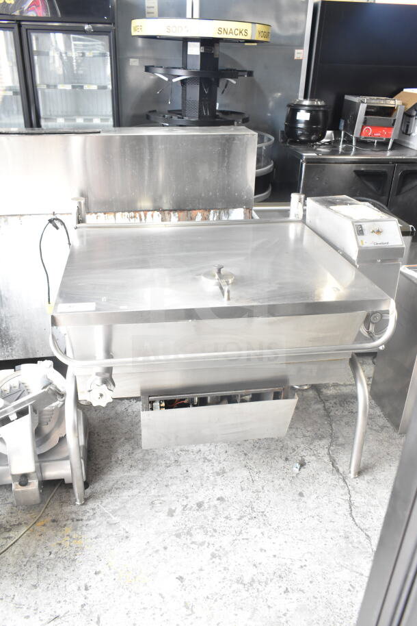 Cleveland Commercial Floor Style Manual Tilt Braising Pan in stainless steel, good condition, with control panel and tilt handle.