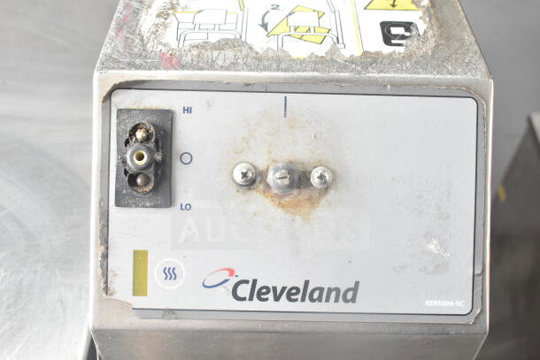 Cleveland Commercial Floor Style Manual Tilt Braising Pan control panel with visible wear and labels.