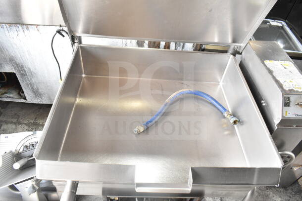 Cleveland Commercial Floor Style Manual Tilt Braising Pan, stainless steel, includes blue hose, visible brand label, excellent condition.