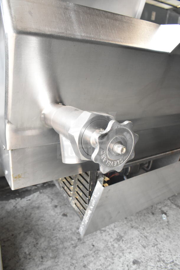 Cleveland Commercial Floor Style Manual Tilt Braising Pan, stainless steel, visible tilt handle with Cleveland marking.