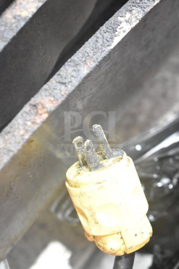 Cleveland Commercial Floor Style Manual Tilt Braising Pan, seen with power connector, showing signs of wear.