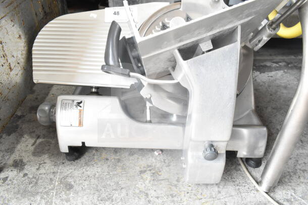 Hobart HS6N commercial 13" slicer, heavy-duty, manual, 120 volts, in good condition. Visible safety and model labels.