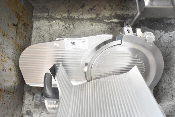 Hobart HS6N 13" heavy-duty manual slicer, stainless steel, 120V, 1 phase. Auction label visible, shows moderate use.
