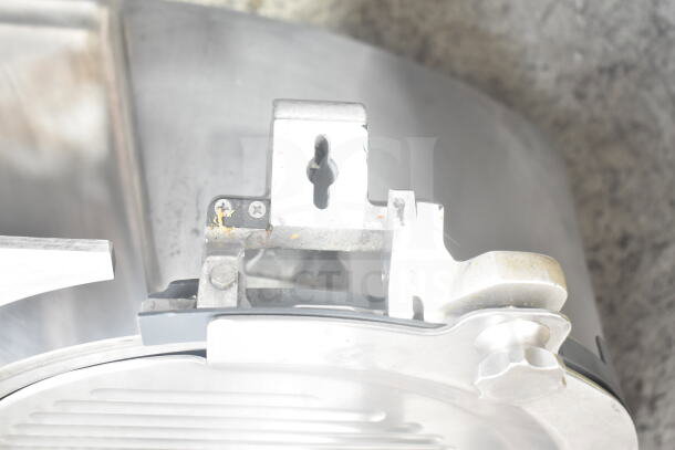Hobart HS6N commercial countertop slicer detail, showing heavy-duty stainless steel components. Model identification partially visible.