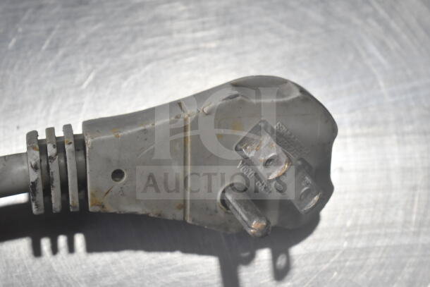 Close-up of a worn electrical plug attached to Hobart HS6N slicer. Surface shows signs of use. 120 Volts, 1 Phase.