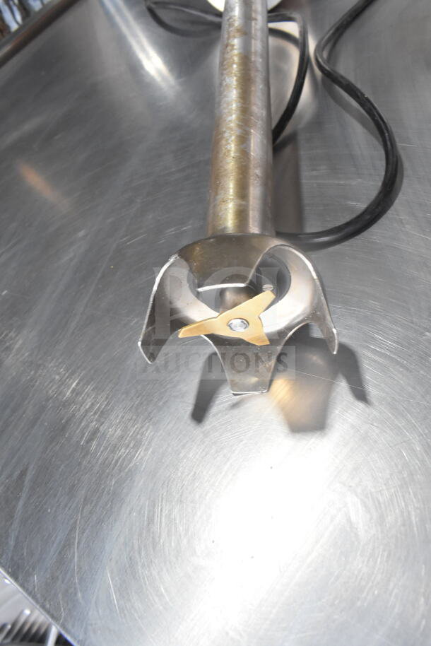 Dynamic MF90 Commercial Immersion Blender, stainless steel, 115V, 1 phase, shown on metal surface, visible power cord.