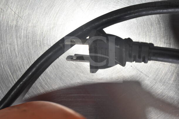 Power cord of Dynamic MF90 Commercial Immersion Blender, 115 volts, 1 phase; shown on a metallic surface.