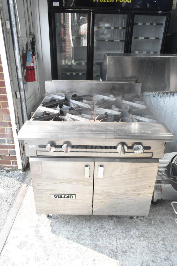 Vulcan Commercial 4 Burner Gas Range, floor style, stainless steel, used condition, visible knobs and Vulcan branding.