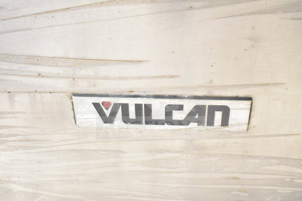 Vulcan Commercial 4 Burner Gas Range, metal finish, brand logo visible, suitable for professional kitchens.