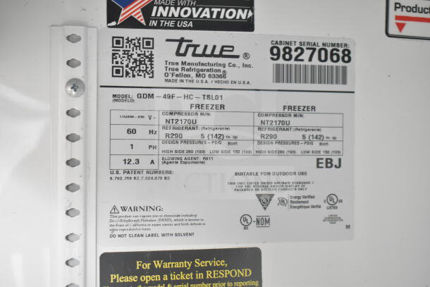 Label for True GDM-49F-HC Freezer, showing model, refrigerant, voltage specs, and safety warnings.
