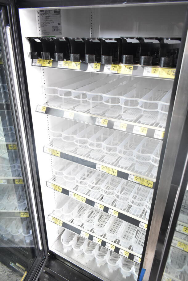 2019 True GDM-72-HC Commercial 3 Door Cooler, 115V, 1 Phase. Shelves feature price tags and product dividers.