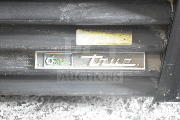 True GDM-49-HC logo on a cooler with "Natural Refrigerant" label, showing commercial use and eco-friendly features.