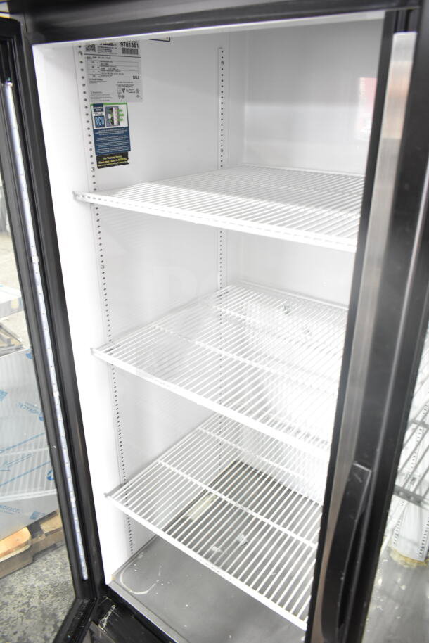 2019 True GDM-49-HC cooler merchandiser, commercial, 2-door, 115 volts, excellent condition, displaying interior shelves.