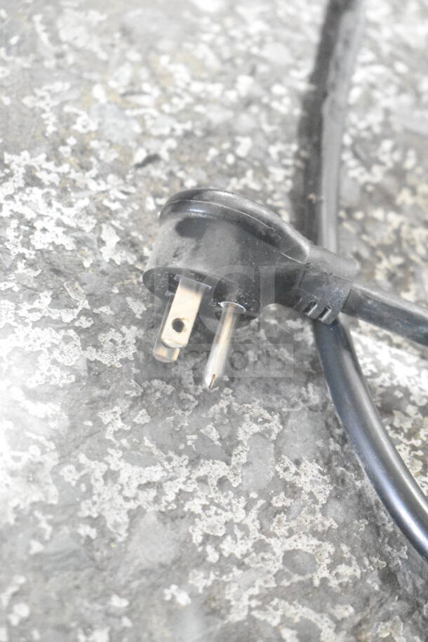 Close-up of the power plug of a True GDM-49-HC Commercial Cooler, showing a standard 115V, 1-phase plug.