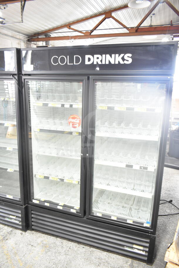 2019 True GDM-49-HC, 2-door reach-in cooler merchandiser, commercial use, 115 volts, glass doors displaying interior shelves.