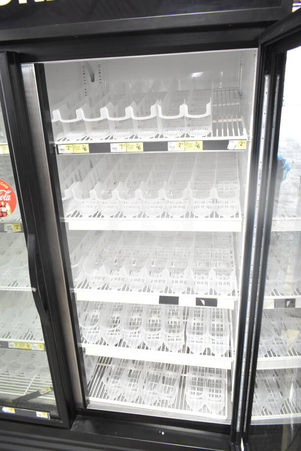 2019 True GDM-49-HC 2-door reach-in cooler in clean condition with shelving. 115V, 1 phase. Ideal for merchandising.