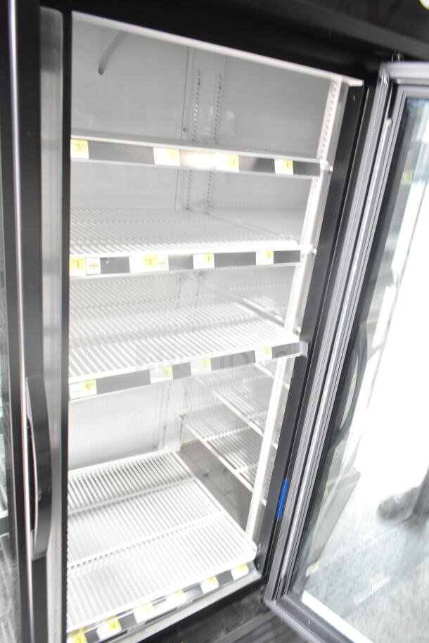 2019 True GDM-72-HC commercial 3-door reach-in cooler merchandiser, 115 volts, 1 phase, excellent condition.