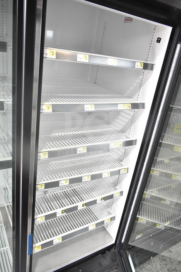 2019 True GDM-72-HC commercial 3-door cooler merchandiser, 115V, 1 phase. Features glass doors, adjustable shelves.
