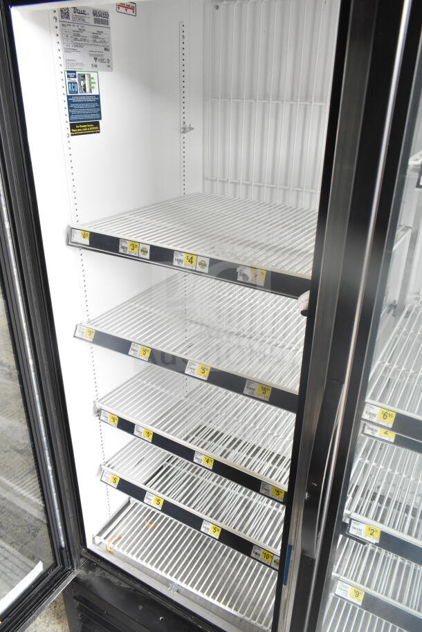 2019 True GDM-72F-HC 3-door reach-in freezer in excellent condition, featuring interior shelves and voltage requirements.