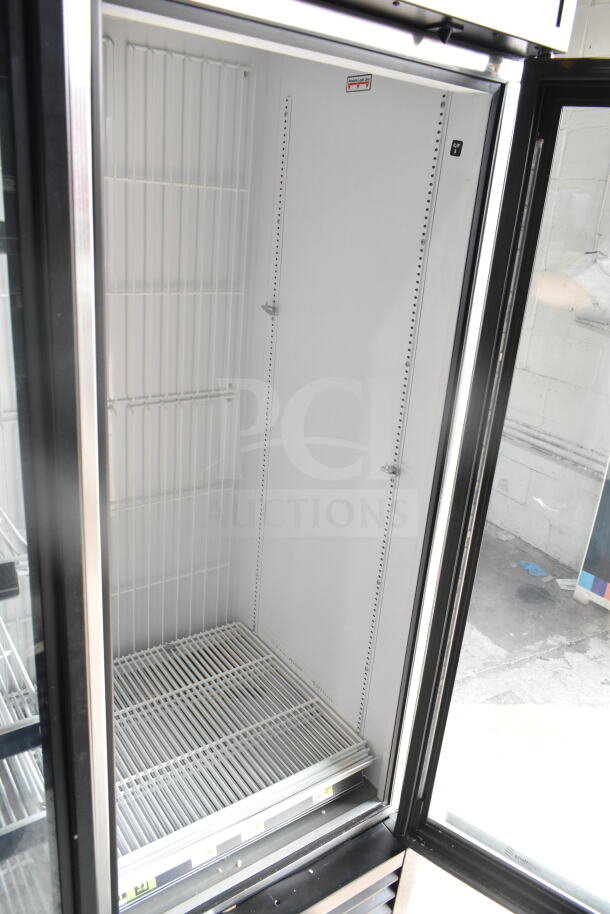 2019 True GDM-72F-HC Commercial 3 Door Reach In Freezer Merchandiser, featuring spacious interior, glass doors, and sturdy shelves.
