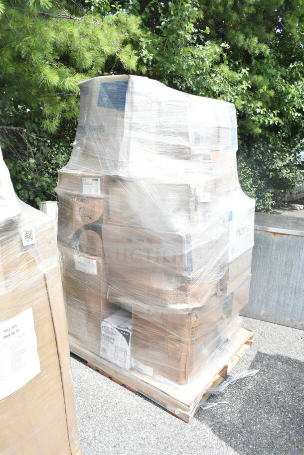 26 new scratch and dent items including sandwich bags, deli containers, and paper towels, wrapped on a pallet.