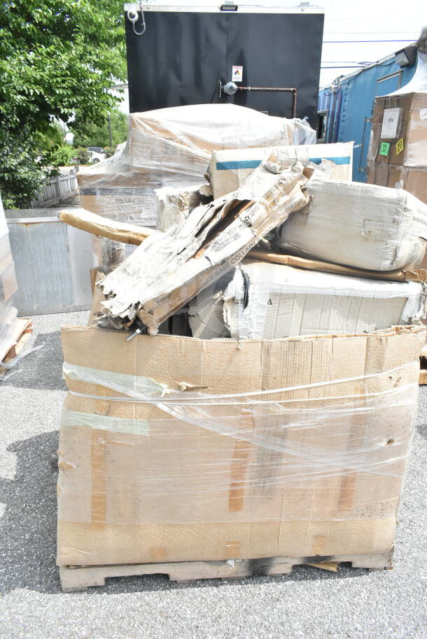 A pallet with 9 brand new scratch and dent items, including a shelf, pot rack, and grease trap in damaged packaging.