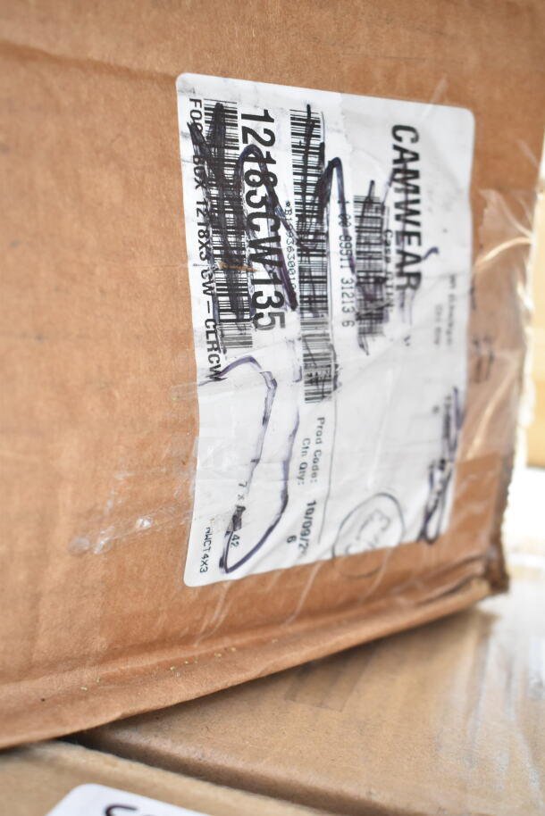 Cardboard box with visible label showing product code and numbers, indicating scratch and dent items, including bowls and glasses.