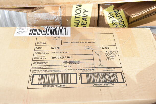 Cardboard box labeled with "Nude Logo" stemware details, showing product size as ~135 cc 4 1/2 US oz, made in Turkey.