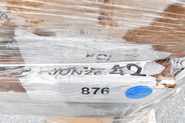 Plastic-wrapped pallet labeled JUN26-42, containing 27 new scratch and dent items: cold cups, napkins, foil, towels.