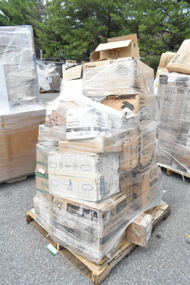 Shrink-wrapped pallet of scratch and dent items including cold cups, napkins, foil, and towels. Various brands visible.