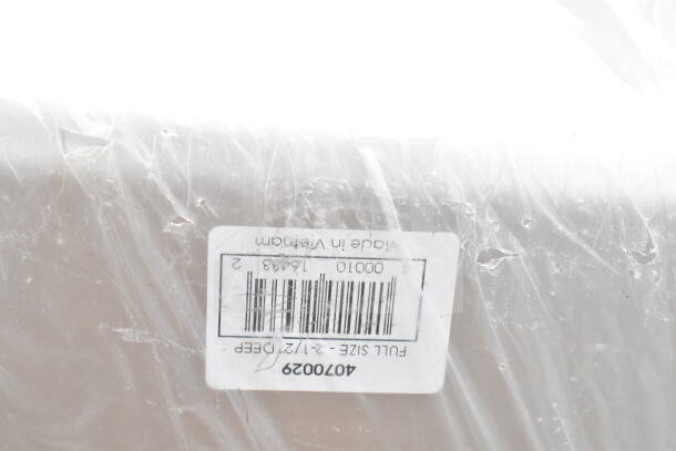 Scratch and dent item with visible barcode label reading "4070029, Full Size, Made in Vietnam," wrapped in plastic.