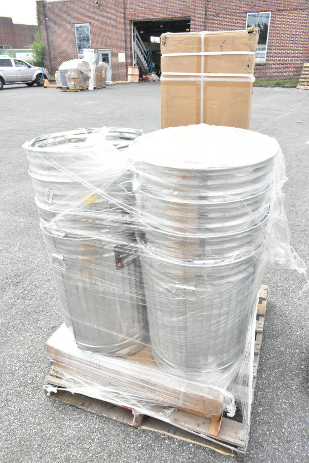 Plastic-wrapped pallet of new scratch and dent items, including metal trash cans and cardboard boxes, auction item JUL26-101.