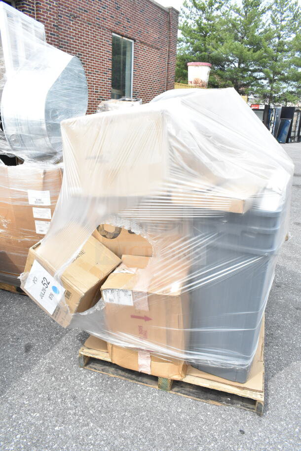 Plastic-wrapped pallet containing boxed scratch and dent items including mixing glasses, pepper shakers, and more. Lot JUL26-52.