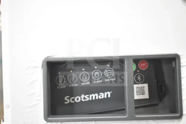 Scotsman MC0330MAX-1A Ice Machine control panel with power, status, water, clean, bin full indicators; brand logo visible.