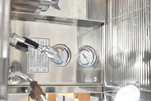 BRAND NEW Estella ECEM2/N2 espresso machine, gauges visible; commercial, automatic, 220-240V, with 3 portafilters.