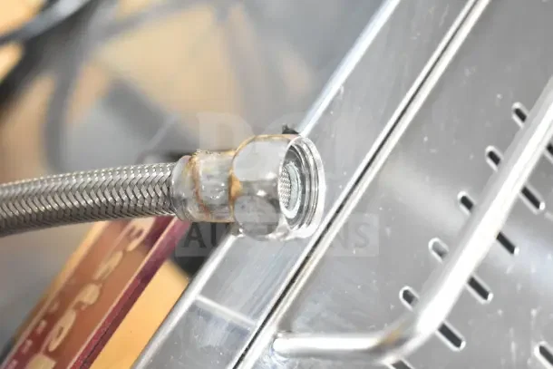 Brand new Estella ECEM2/N2 commercial espresso machine hose detail; stainless steel, minor scratches visible.