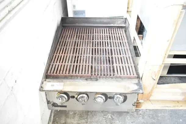 Star Commercial Countertop Gas Powered Charbroiler Grill with three control knobs, metal grates; used condition.