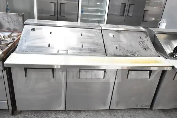 2018 True TSSU-72-30MB-ST-HC sandwich prep table, stainless steel, 115V, 1 phase, visible wear, commercial casters.