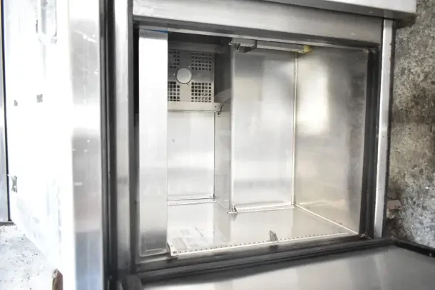 2018 True TSSU-72-30MB-ST-HC commercial sandwich salad prep table; stainless steel interior, on casters, model label visible.