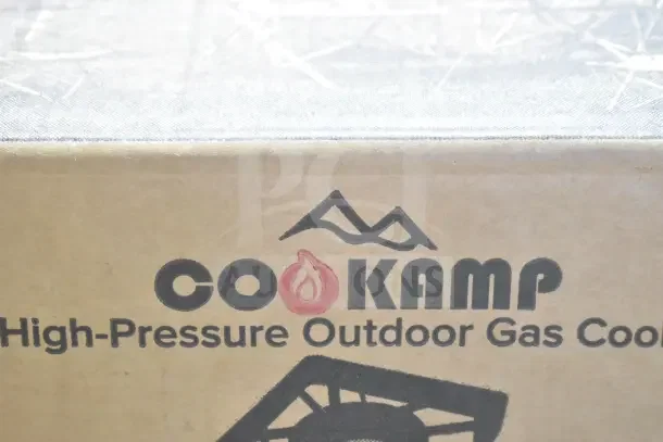 CooKamp SA1100 box featuring "High-Pressure Outdoor Gas Cooker" text. Brand new with scratches and dents.