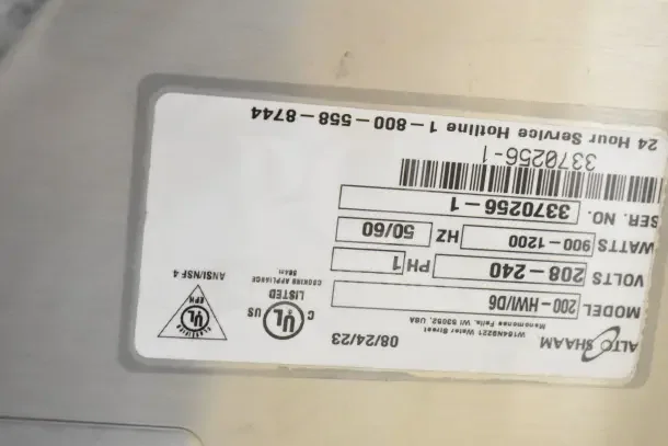 Label on brand new 2023 Alto Shaam 200-HWI/D6, indicating 208-240 volts, 1 phase, 900-1200 watts, serial number 3370256-1.