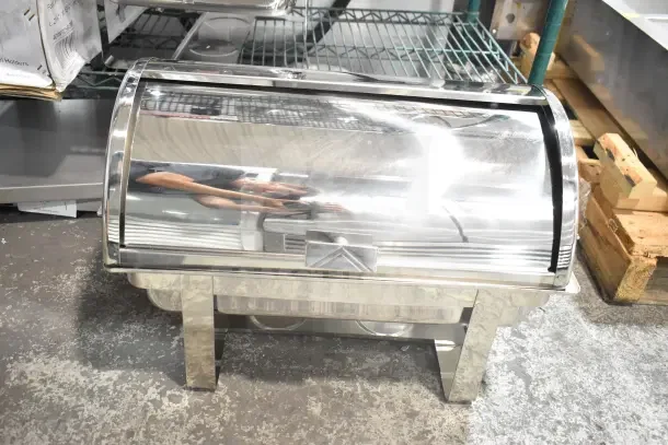 Brand new Choice Deluxe 8 Qt. Full Size Chrome Accent Roll Top Chafer, slightly scratched, sturdy metal legs.
