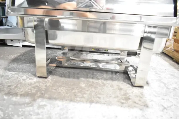 Choice Deluxe 8 Qt. Chrome Accent Roll Top Chafer, brand new with minor scratches, shiny silver finish, sturdy legs.