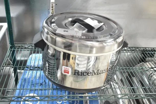 Brand new RiceMaster 56912S sushi rice container, 64-cup, stainless steel finish, minor dents, labeled.